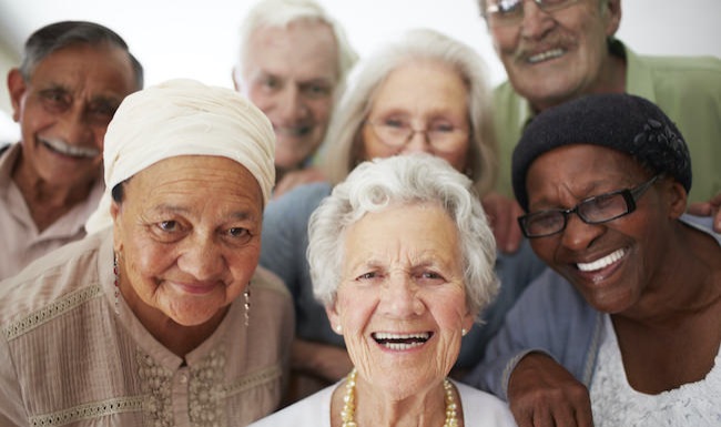 Diverse group of seniors smiling at the camera