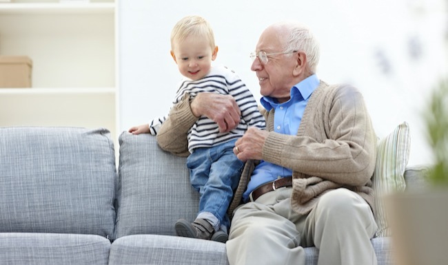 Homepage small ad with senior man and toddler sitting on a couch
